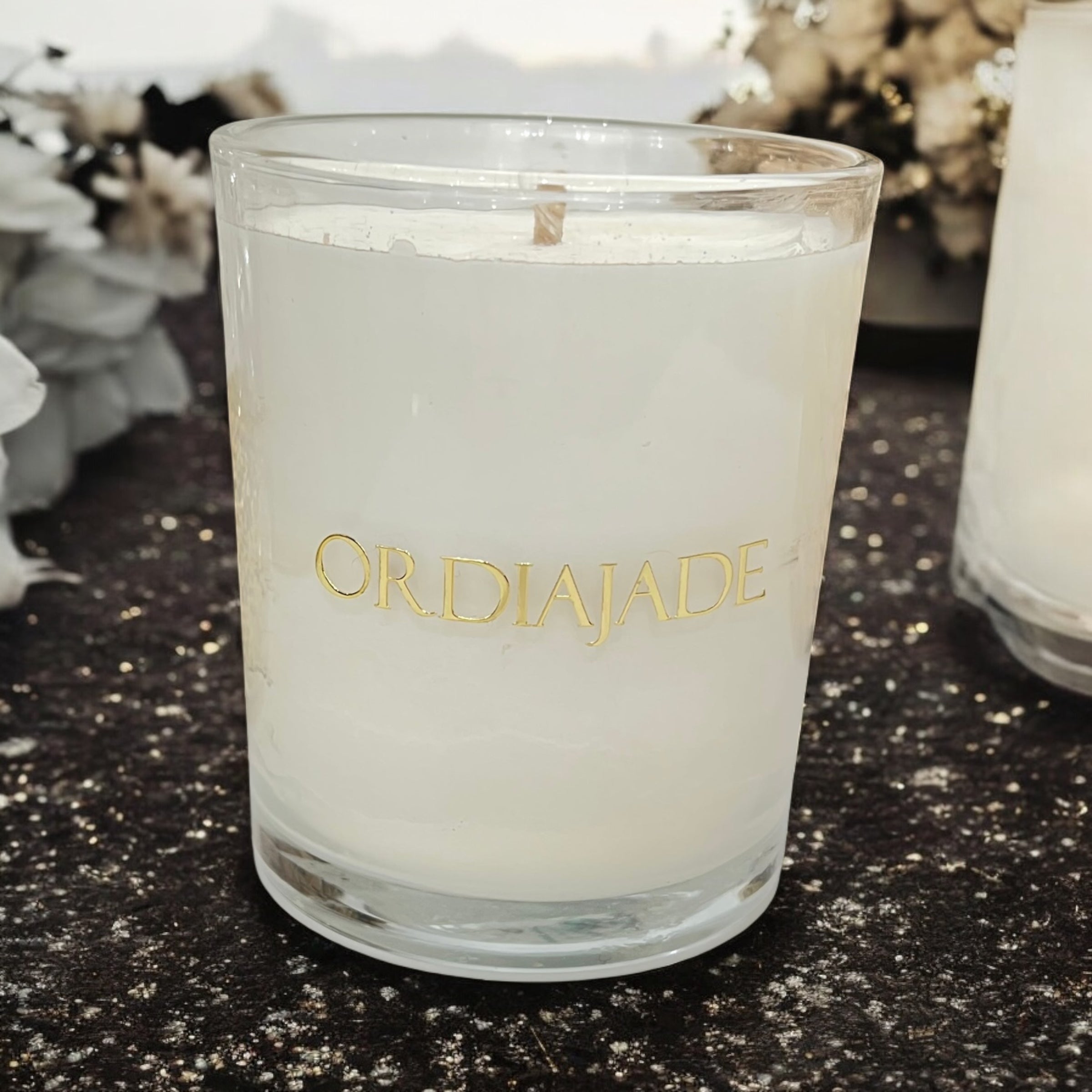Bougie Ordiajade en cire de soja à bijou caché, sur fond pailleté