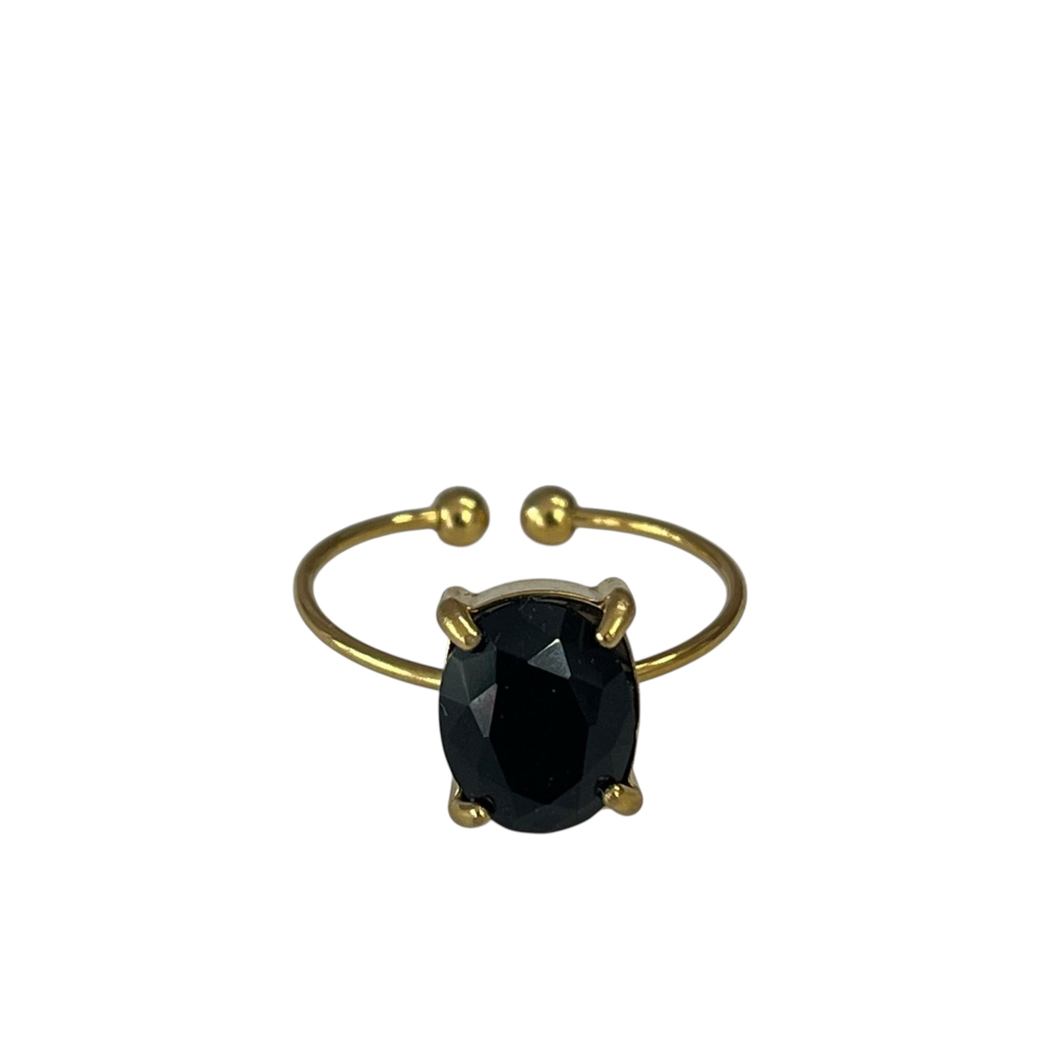 Bague Camille dorée ouverte sertie d'une pierre ovale noire facettée, sur fond blanc - Ordiajade