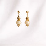 Boucles d'oreilles pendantes Kyto Ordiajade isolées sur fond blanc