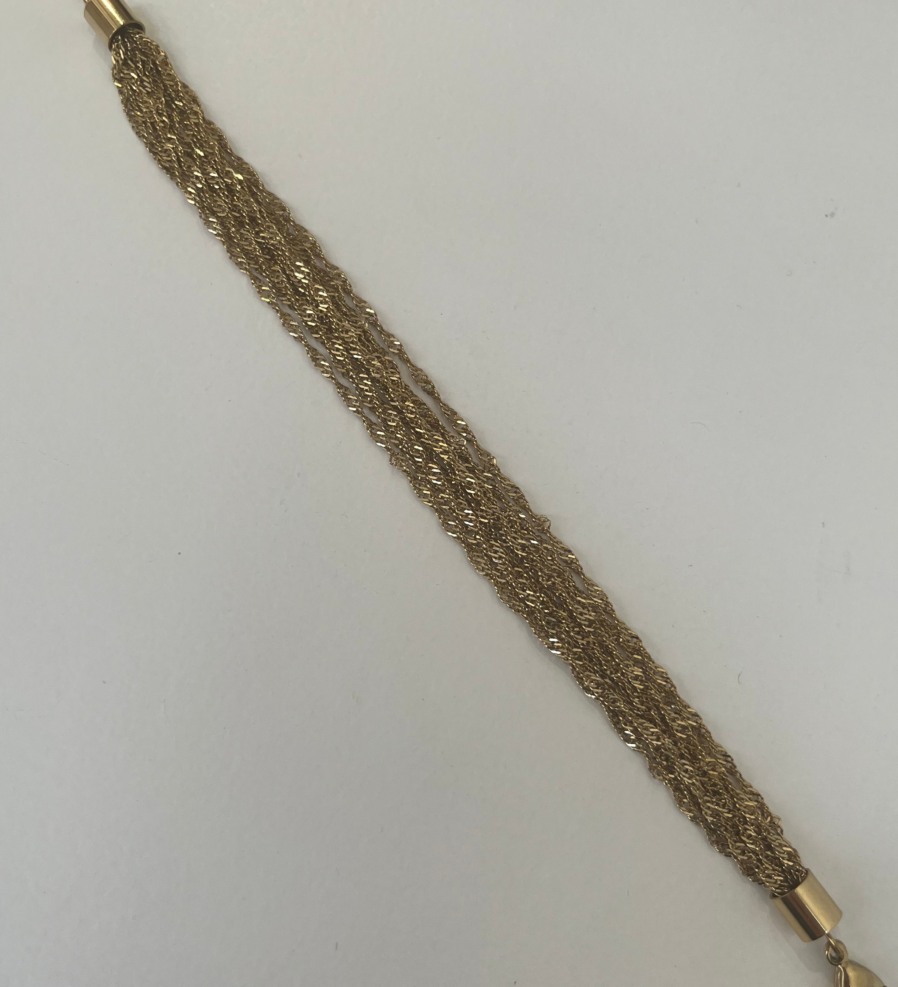 Bracelet doré Swinie en acier inoxydable étalé à plat - Ordiajade