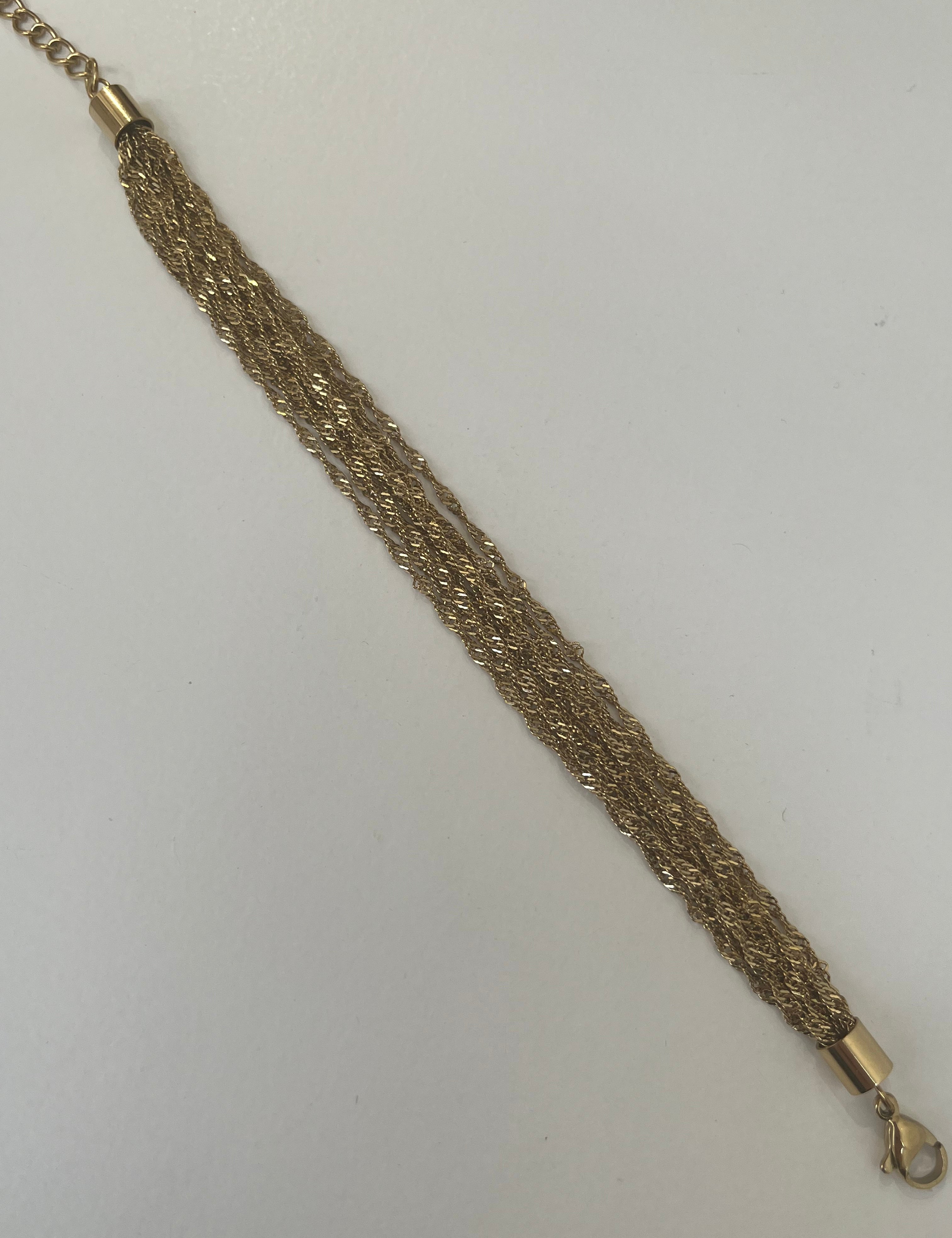 Bracelet doré Swinie en acier inoxydable étalé à plat - Ordiajade