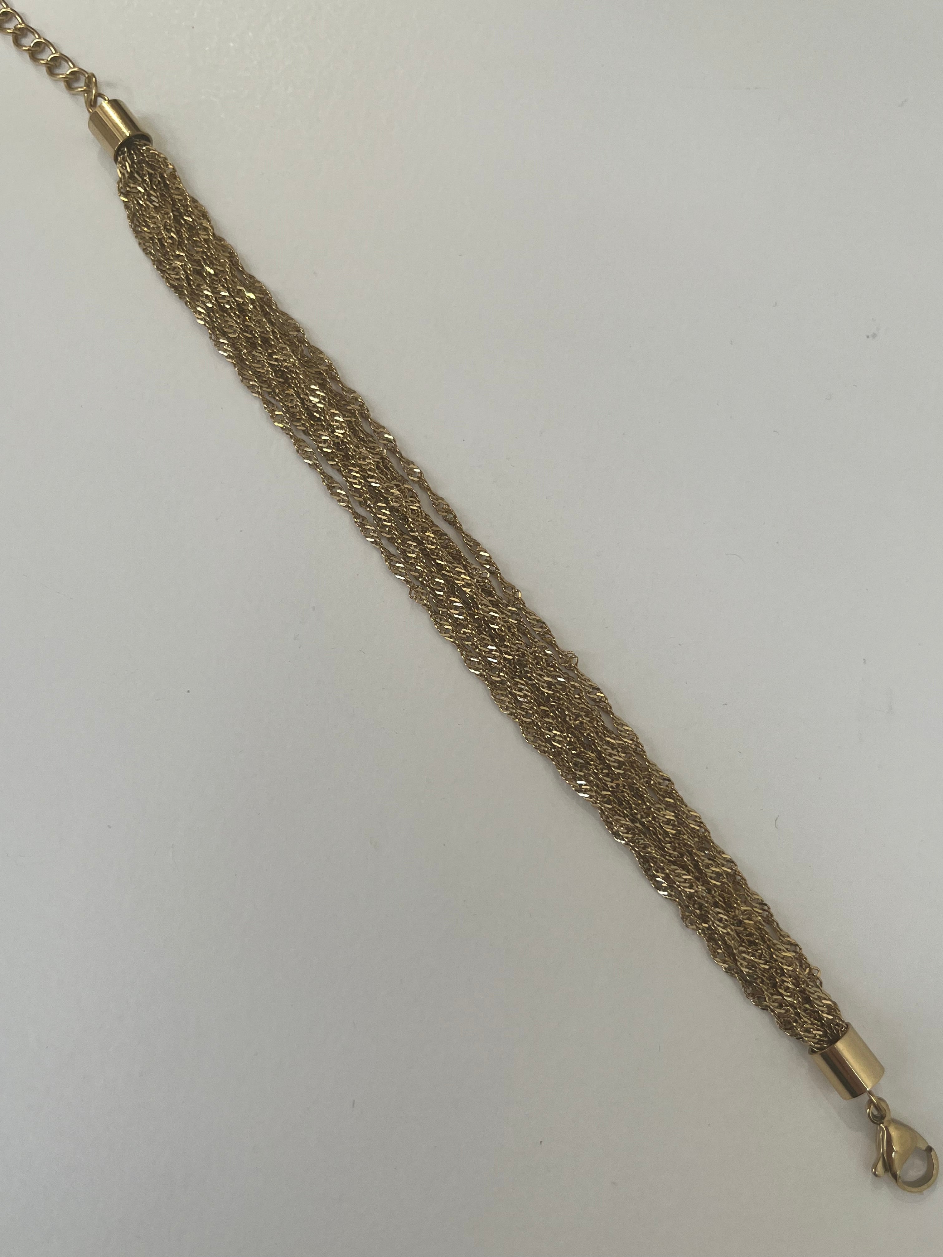 Bracelet doré Swinie en acier inoxydable étalé à plat - Ordiajade