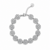 Bracelet argenté de style chaînette composé de médaillons ronds ciselés et pavés de strass brillants posé à plat - Ordiajade