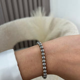 Bracelet Bay argenté à billes en acier inoxydable porté au poignet - Ordiajade