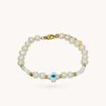 Bracelet Someone en perles d'eau douce avec pampille œil protecteur bleu posé à plat - Ordiajade