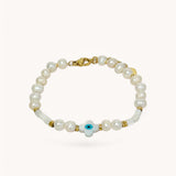 Bracelet Someone en perles d'eau douce avec pampille œil protecteur bleu posé à plat - Ordiajade