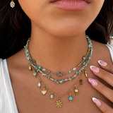 Accumulation de colliers fins en acier inoxydable doré dont le collier Jade aux pierres naturelles turquoises et pampilles soleil - Ordiajade
