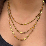 Collier Odéon doré à trois rangs de pastilles ovales porté au cou - Ordiajade