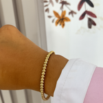 Bracelet jonc June doré porté au poignet - Ordiajade