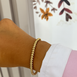 Bracelet jonc June doré porté au poignet - Ordiajade